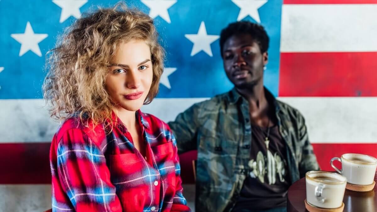 Young American couple having fun at cafe - representing modern American names and diverse culture