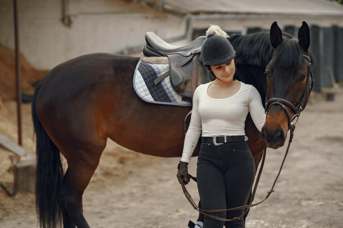 Elegant girl with her beautiful horse on the farm - perfect inspiration for horse names