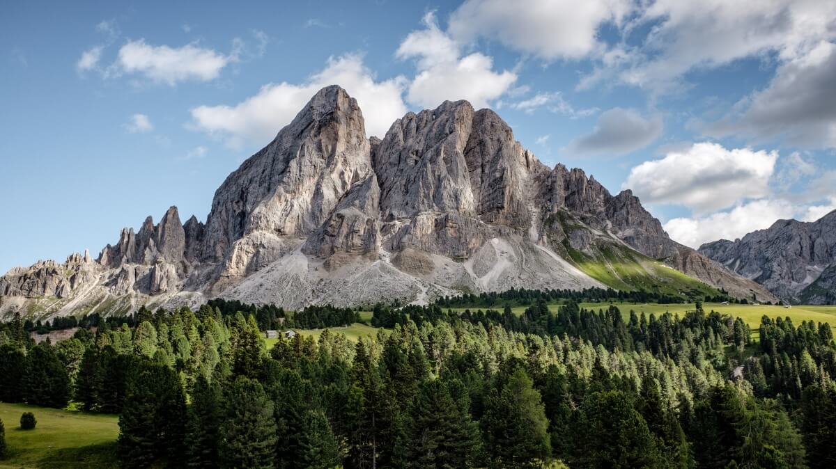 Majestic snow-covered mountain peak against blue sky - inspiration for epic mountain names